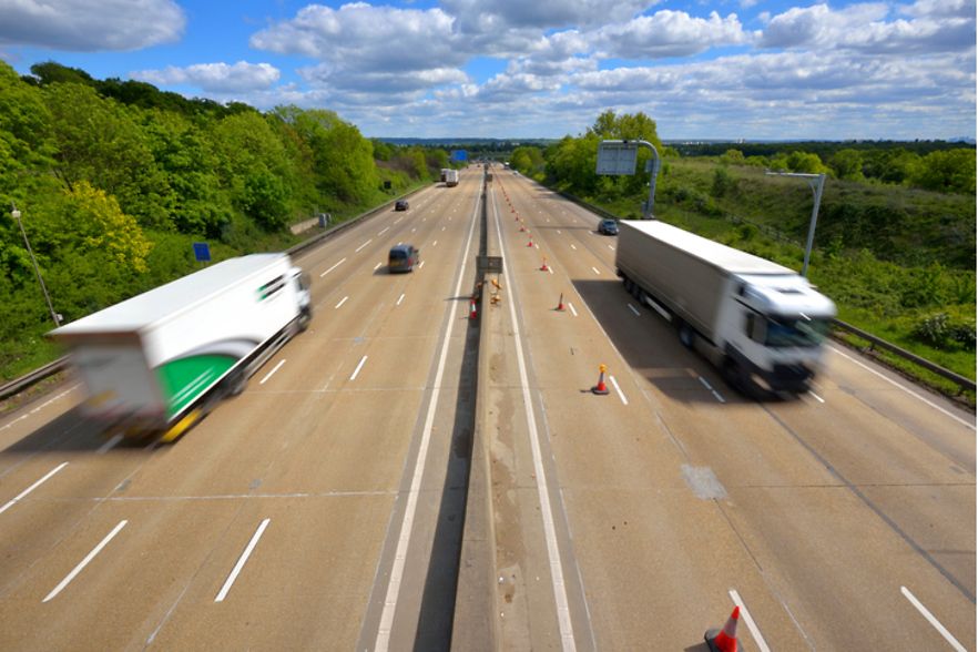 Large lorries moving on the M25 Motorway