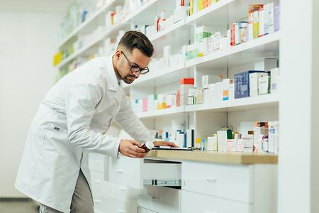 Portrait,Of,A,Handsome,Pharmacist,Working,In,A,Pharmacy,While