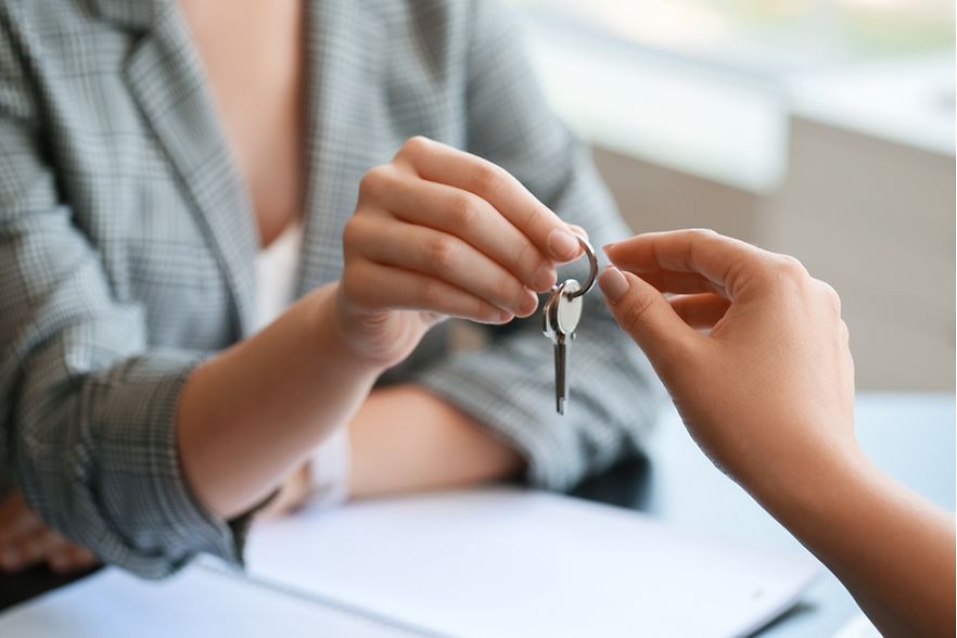Real,Estate,Agent,Giving,Key,From,House,To,Client,In