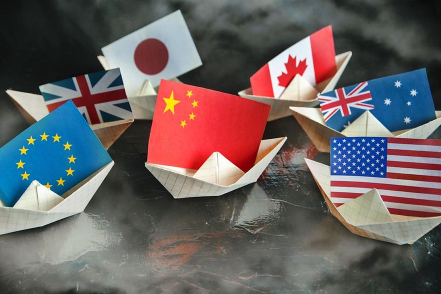 Paper,Ship,With,Flags,Of,Usa,,Great,Britain,,Canada,,Australia,