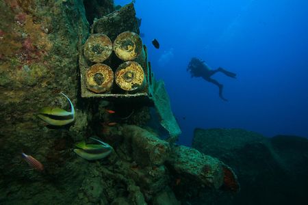 Shell,Cases,And,Diver,On,The,Wreck,Of,Ss,Thistlegorm