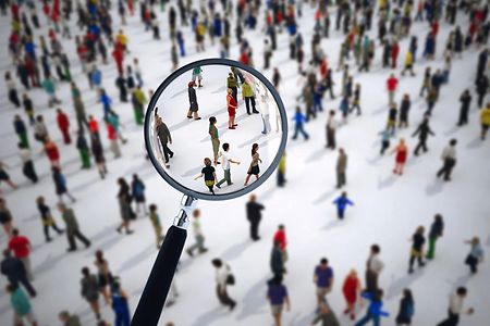 Magnifying glass on a large group of people. 3D Rendering
