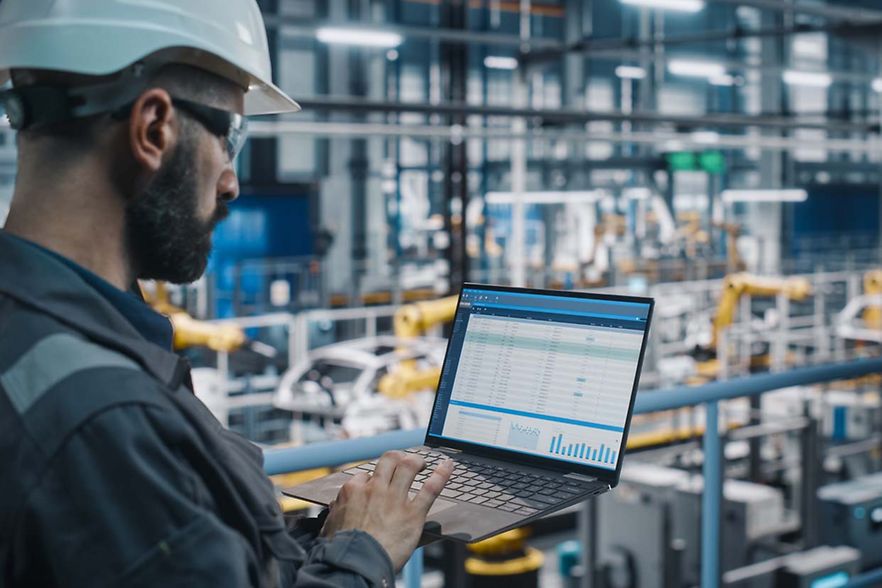 Car,Factory,Engineer,In,Work,Uniform,Using,Laptop,Computer,With