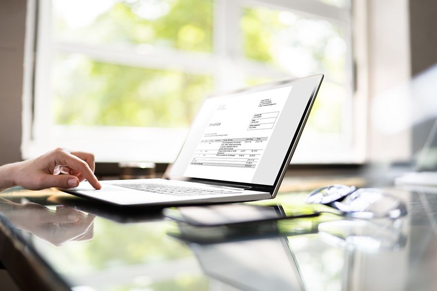 Accountant,Calculating,Electronic,Invoice,Or,E,Bill,At,Desk