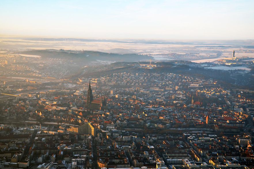 Aerial view of foggy Ulm, south germany on a sunny winter day