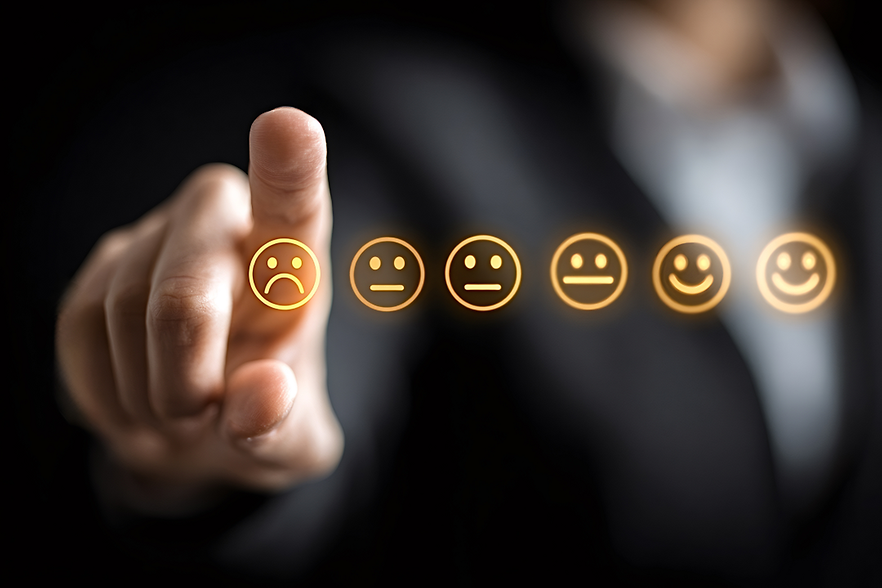 DIHK-Blitzumfrage zu den USA 6 Smileys - von links unzufrieden bis lächelnd - ein Zeigefinger zeigt darauf