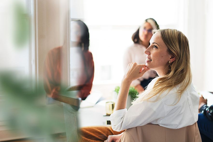 Happy business women in a meeting