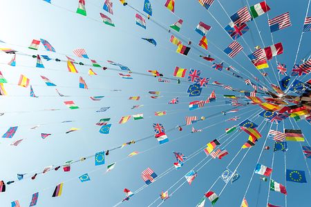 Party flags blowing against the sky in a clear summer afternoon