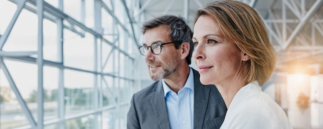 Businesswoman and businessman at the airport