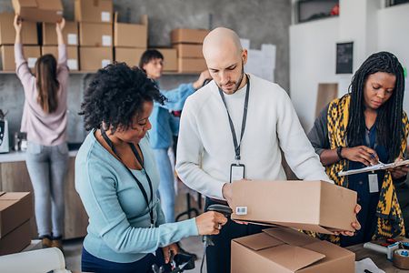 Diverse group of people arranging customers orders for drop shipping