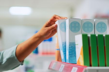 Asian,Customer,Putting,Boxes,Of,Drugs,In,Basket,,Buying,Pharmaceutical