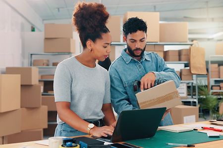 Box,,Laptop,And,Planning,With,People,In,Distribution,Warehouse,For