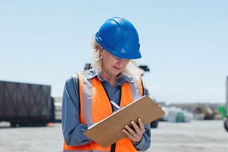 Logistics,,Woman,Or,Writing,On,Clipboard,In,Yard,For,Shipping